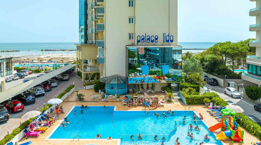 Hotel pool beside beach and sea